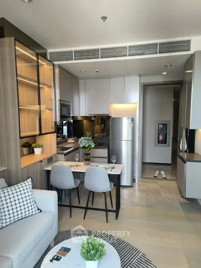 Modern open-layout kitchen with dining area and stylish decor