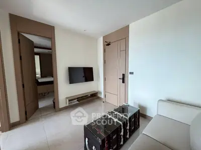 Modern living room with sleek TV setup and stylish furniture