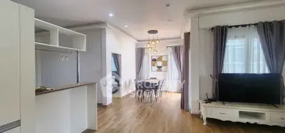 Spacious open-plan living and dining area with modern decor and natural light.