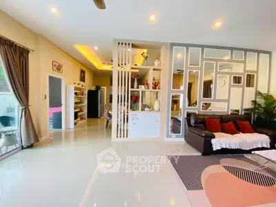 Spacious modern living room with stylish decor and open layout, perfect for family gatherings.