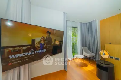 Modern living room with large TV and stylish decor