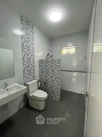 Modern bathroom with stylish tile design and sleek fixtures