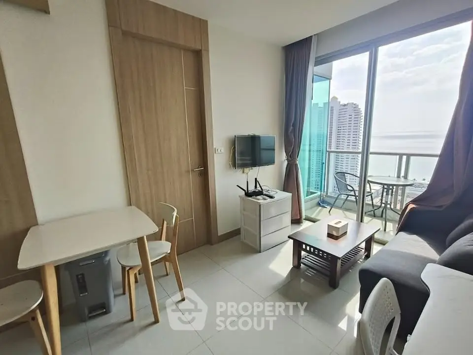 Modern living room with balcony and stunning city view