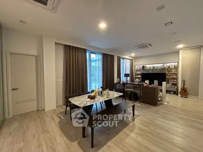 Spacious modern living room with elegant dining area and stylish decor