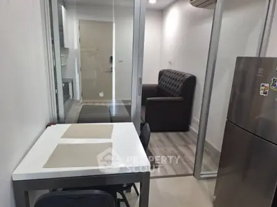 Modern compact apartment with glass partitions and sleek furnishings
