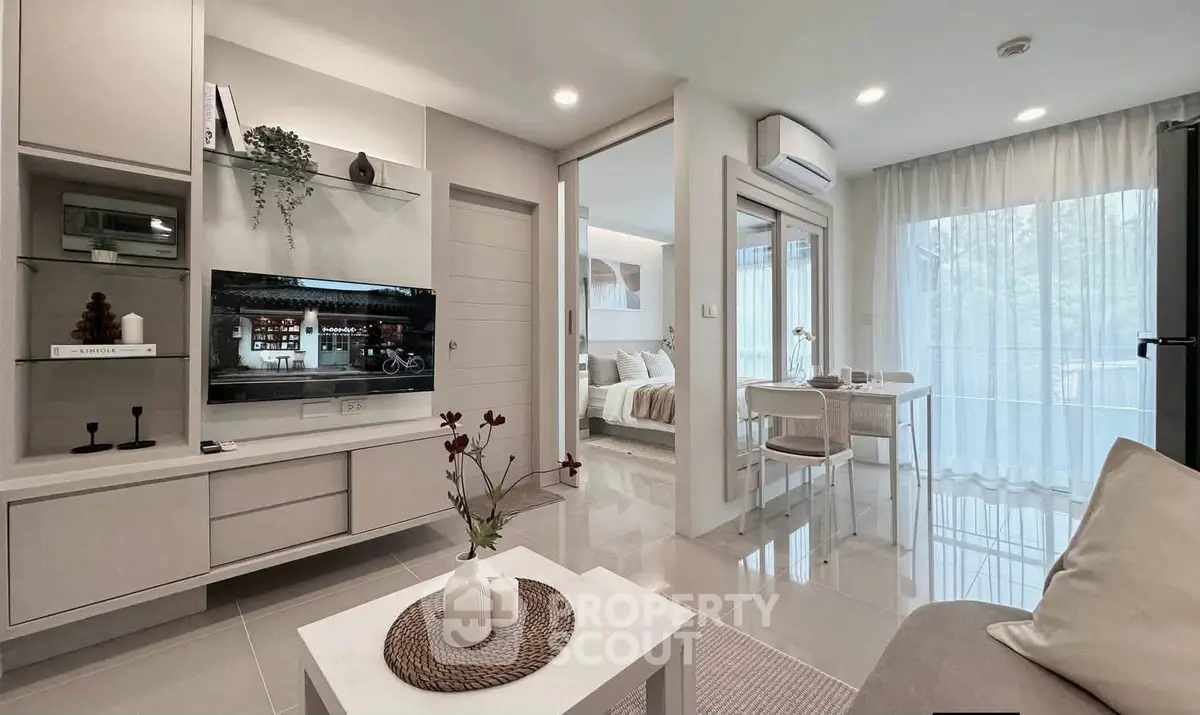 Modern open-plan living room with sleek furniture and natural light