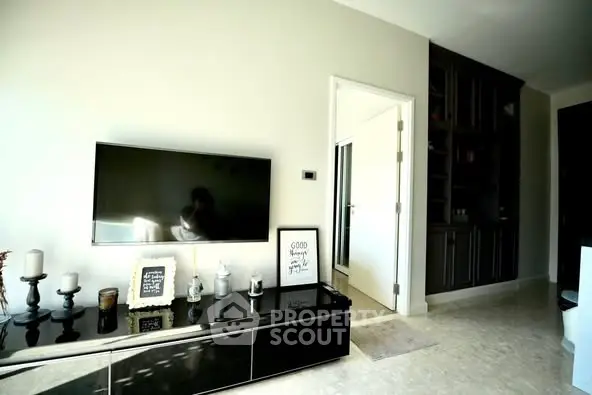 Modern living room with sleek TV setup and elegant decor