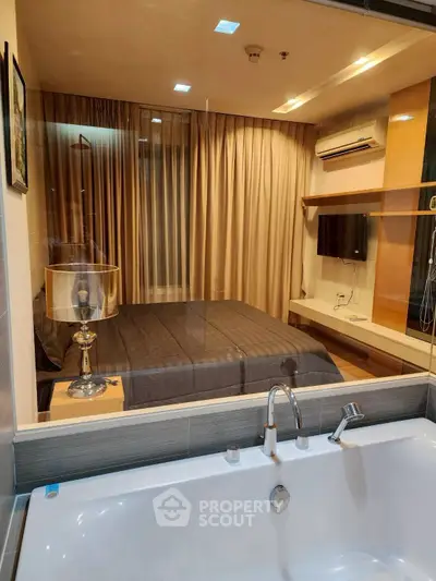 Luxurious bedroom with ensuite bathtub and modern amenities