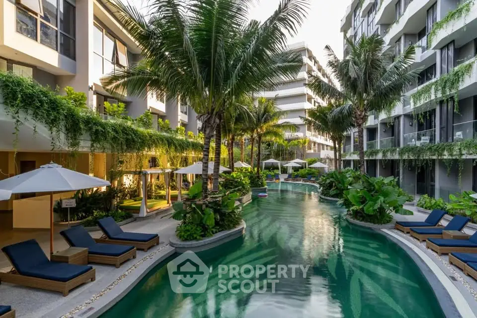 Luxurious apartment complex with tropical pool and lush greenery