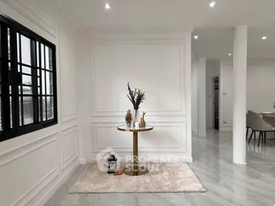 Elegant modern interior with stylish decor and sleek flooring, showcasing a sophisticated living space.