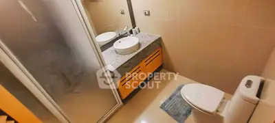 Modern bathroom with sleek design and glass shower enclosure