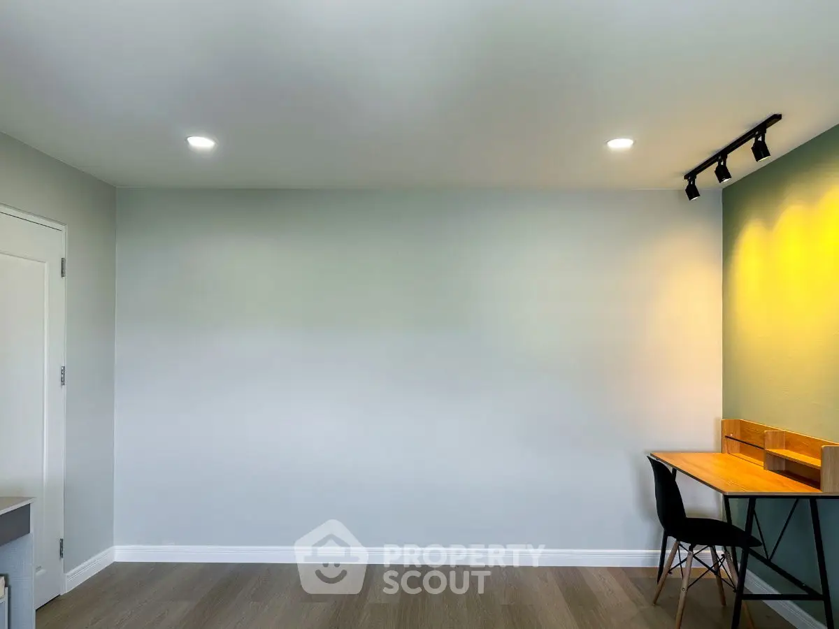 Minimalist study room with modern desk and chair, perfect for productivity.