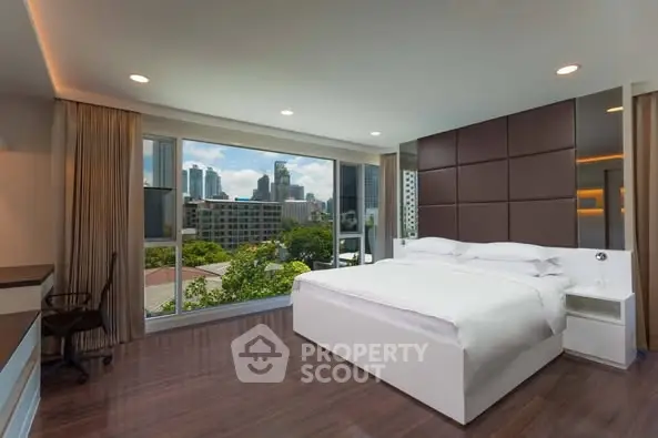 Luxurious bedroom with stunning city view and modern decor