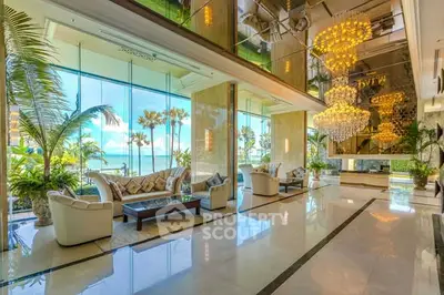 Luxurious hotel lobby with ocean view and elegant chandeliers