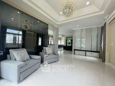 Spacious modern living room with elegant decor and ample natural light