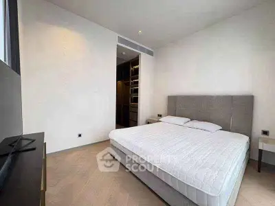 Modern bedroom with minimalist design and walk-in closet