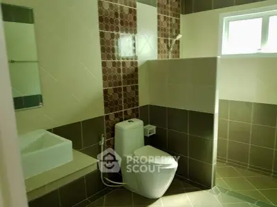 Modern bathroom with stylish tiles and natural light