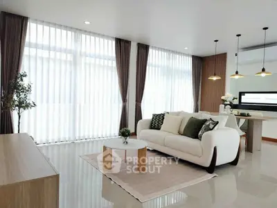 Spacious modern living room with elegant decor and natural light
