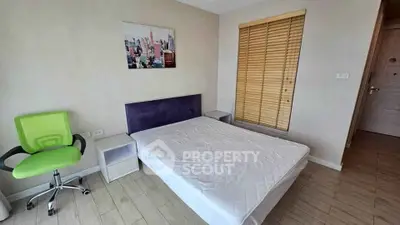 Modern bedroom with stylish decor and natural light