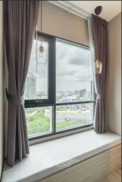 Modern window seat with city view in high-rise apartment