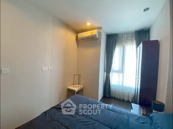 Cozy bedroom with modern air conditioning and natural light