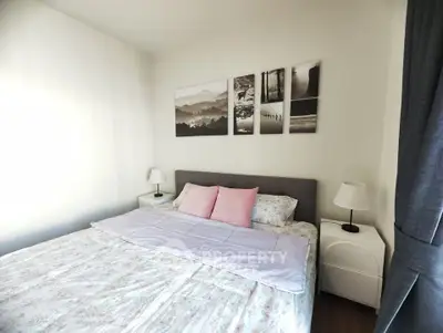 Cozy bedroom with stylish decor and soft lighting, perfect for relaxation.