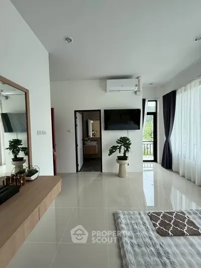 Modern living room with sleek design, large windows, and stylish decor in a contemporary home.