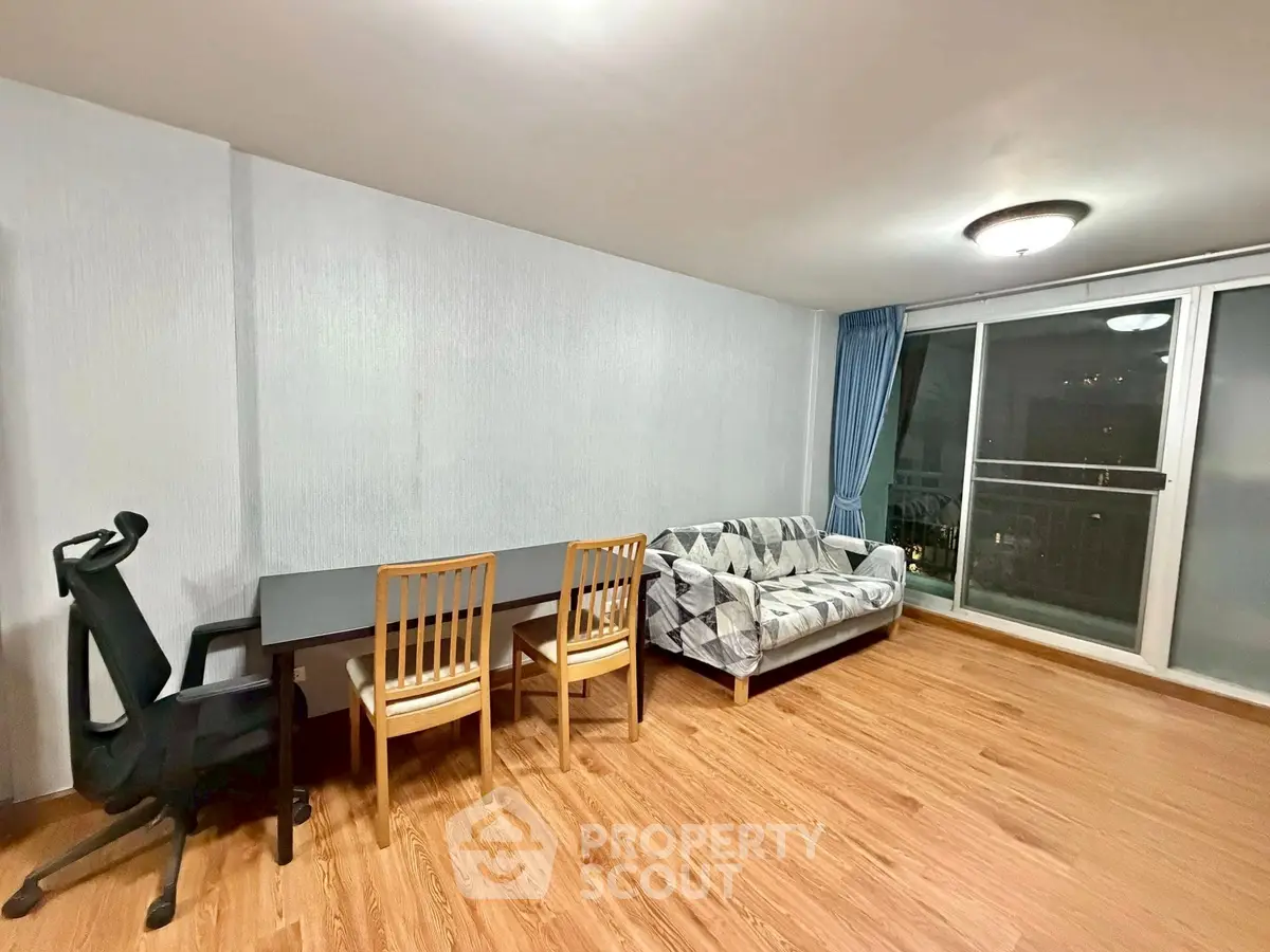 Spacious living room with modern furniture and large windows for natural light.