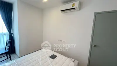 Modern bedroom with air conditioning and natural light