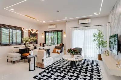 Modern living room with stylish decor and ample natural light