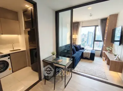 Modern apartment with stylish living room and compact kitchen, featuring city skyline view.