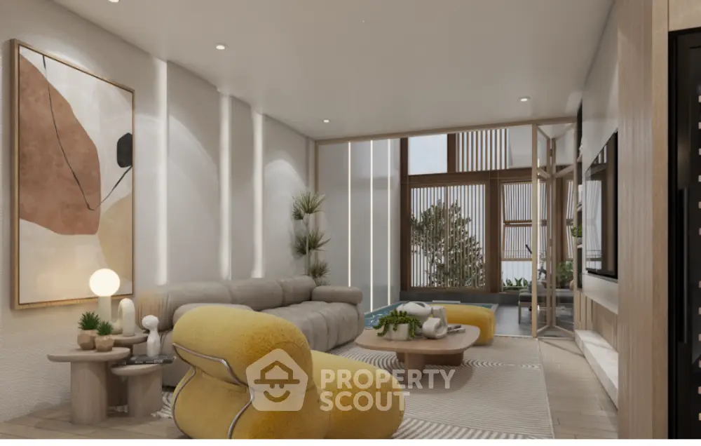 Modern living room with stylish furniture and large windows offering natural light.