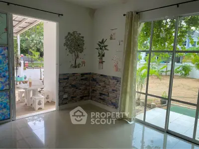 Charming interior with garden view and patio access, perfect for relaxation and entertaining.