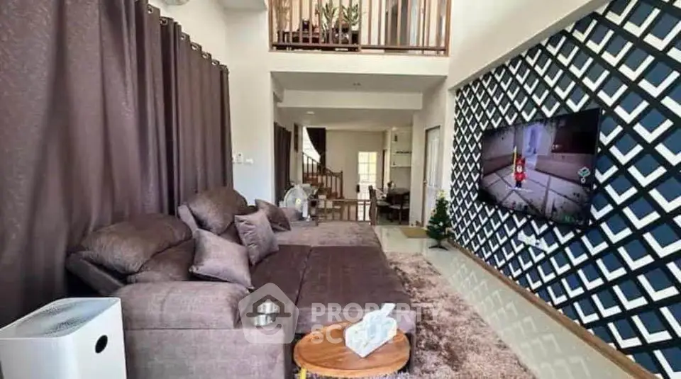 Spacious modern living room with stylish decor and large TV