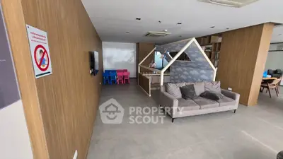 Spacious modern living area with unique playhouse feature and cozy seating.