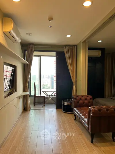 Modern living room with balcony view and stylish furniture in urban apartment