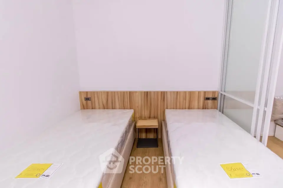 Modern bedroom with twin beds and minimalist design