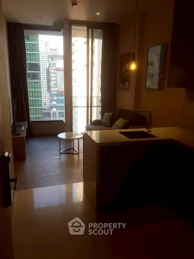 Modern apartment with open kitchen and city view, featuring sleek design and cozy living area.