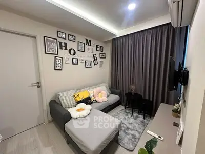 Cozy living room with modern decor and comfortable seating in a stylish apartment.