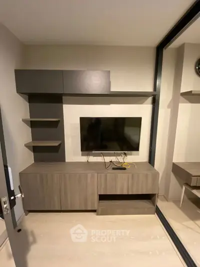 Modern living room with sleek TV unit and stylish shelving