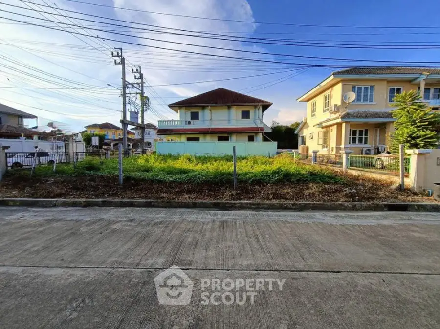 Vacant lot in suburban neighborhood with potential for new construction.