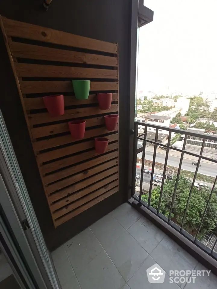 Charming balcony with vertical garden and city view, perfect for urban living.