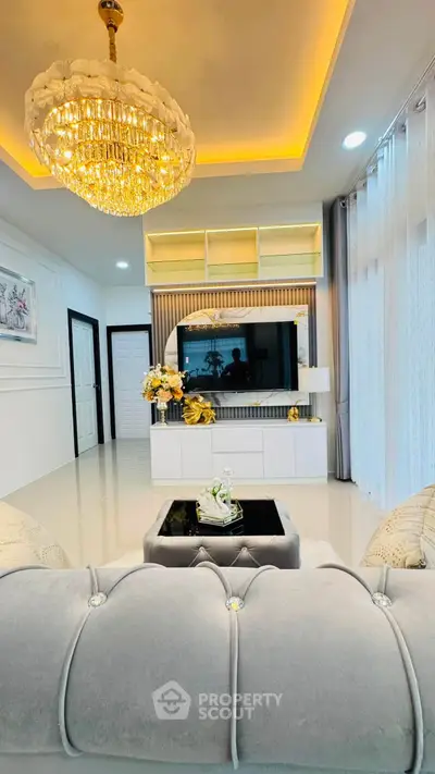 Luxurious living room with elegant chandelier and modern decor