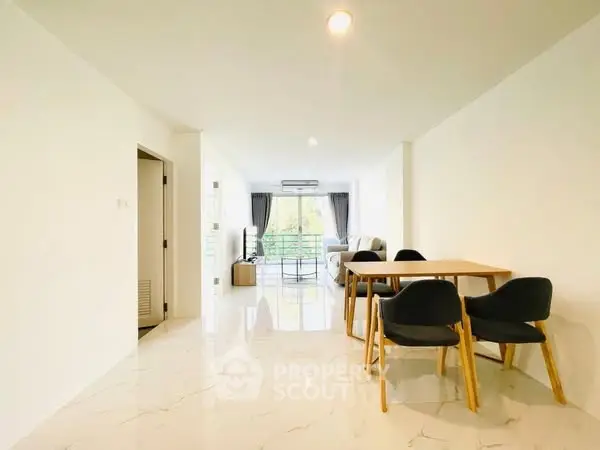 Spacious modern living room with dining area and large windows