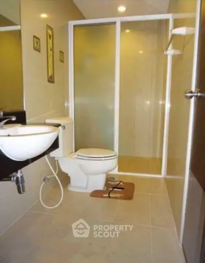Modern bathroom with glass shower and sleek fixtures