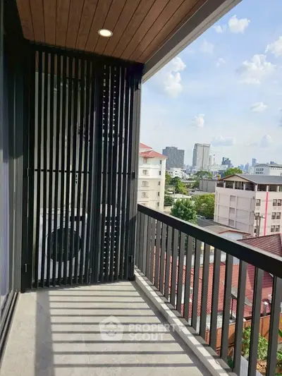 Spacious balcony with city view and modern design in urban apartment