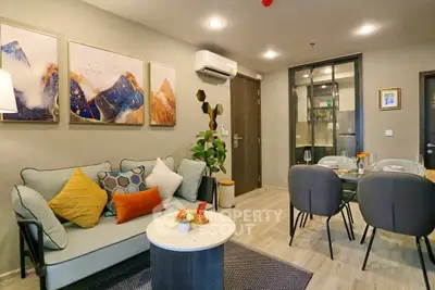 Stylish modern living room with cozy seating and elegant dining area