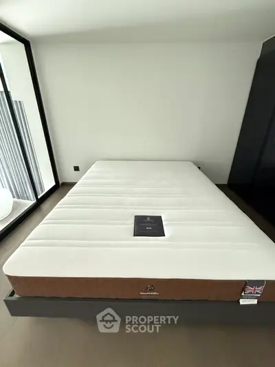 Spacious bedroom with modern mattress and minimalist decor