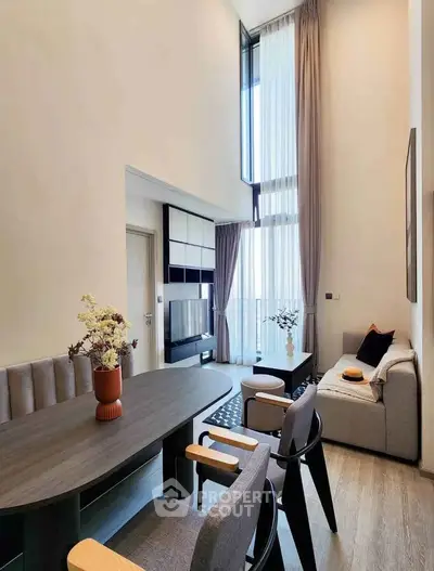 Modern living room with high ceilings and elegant decor