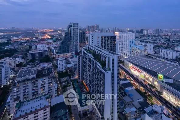 Stunning cityscape view of modern high-rise buildings at dusk, showcasing urban living.